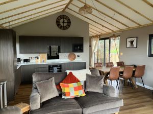 Spacious open plan living area at Birdholme Glamping